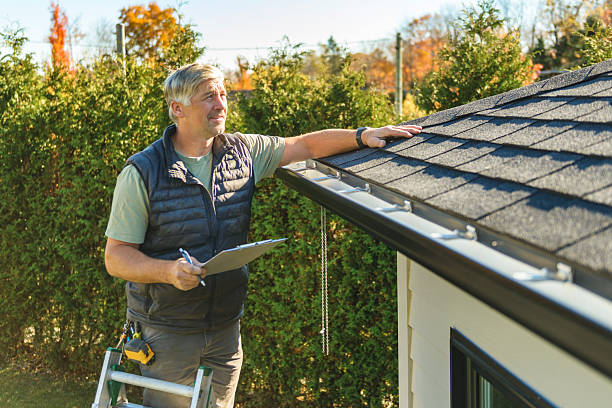 Professional Hail Damage Roof Repair technician working in Akron, IN